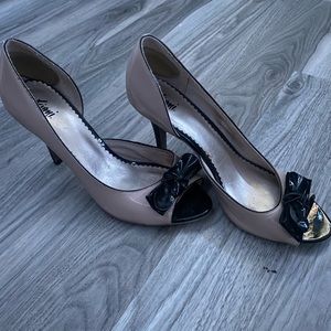 Nude heels with black bow detail
